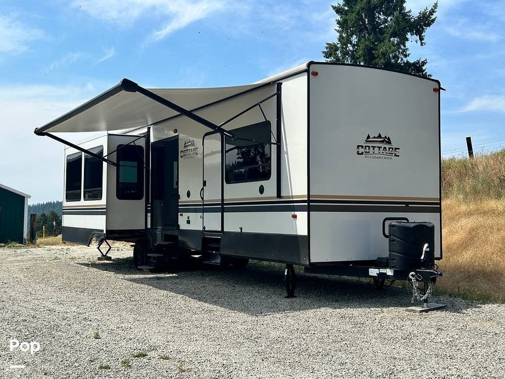 2022 Forest River Cedar Creek 40CRS - Used Travel Trailer For Sale by Pop RVs in Coeur D Alene, Idaho features Air Conditioning, Leveling Jacks, Awning, Slideout
