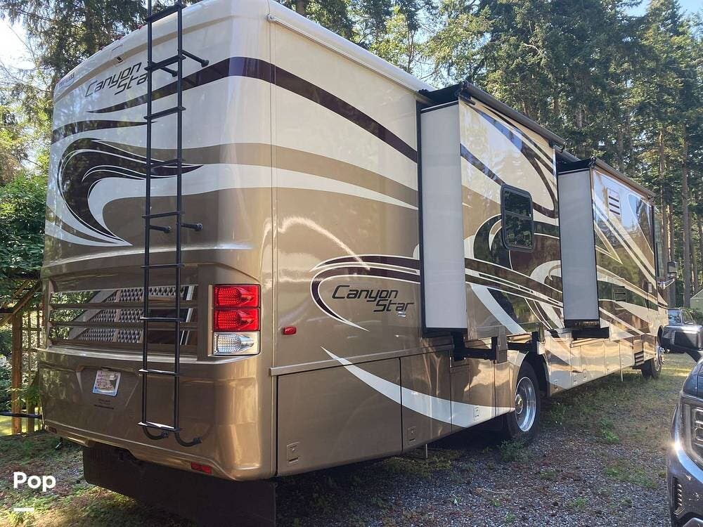 2014 Newmar Canyon Star 3953 - Used Class A For Sale by Pop RVs in Greenbank, Washington features Air Conditioning, Slideout, Generator, Awning, Leveling Jacks