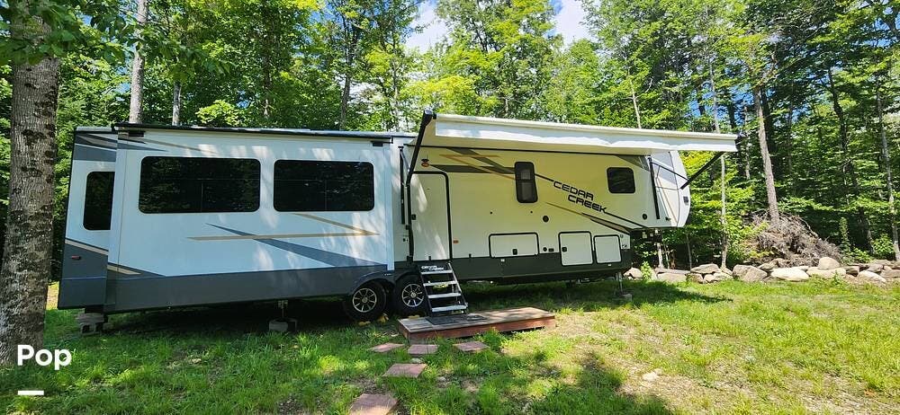 2021 Forest River Cedar Creek 377OF - Used Fifth Wheel For Sale by Pop RVs in The Forks, Maine features Awning, Air Conditioning, Generator, Slideout, Leveling Jacks