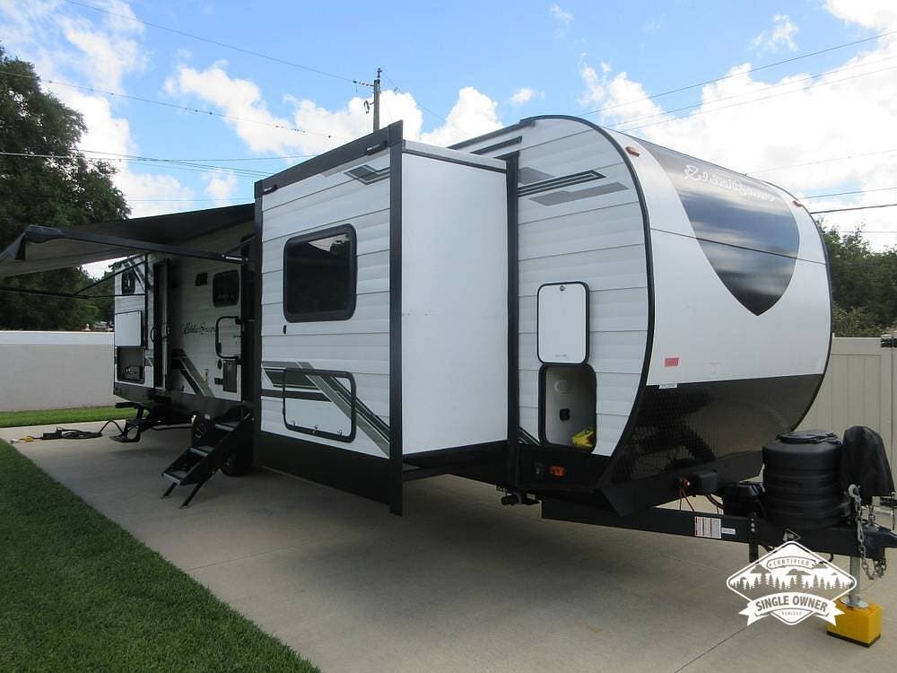 2024 Heartland Eddie Bauer 34BHS - Used Travel Trailer For Sale by Pop RVs in Valrico, Florida features Leveling Jacks, Air Conditioning, Slideout, Awning