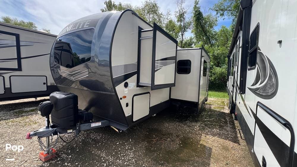2023 Rockwood Mini Lite 2513S - Used Travel Trailer For Sale by Pop RVs in Montgomery, Texas features Slideout, Leveling Jacks, Awning, Air Conditioning