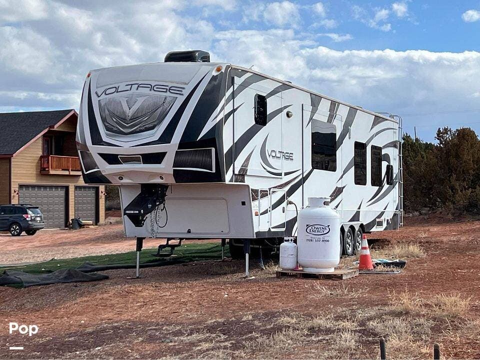 2014 Dutchmen Voltage 3818 - Used Toy Hauler For Sale by Pop RVs in Taylor, Arizona features Generator, Leveling Jacks, Air Conditioning, Awning, Slideout
