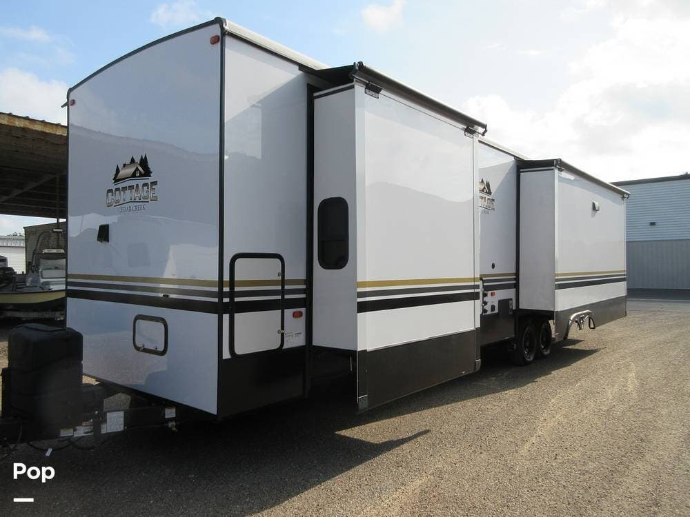 2023 Forest River Cedar Creek 40CRS - Used Travel Trailer For Sale by Pop RVs in La Feria, Texas features Slideout, Leveling Jacks, Awning, Air Conditioning