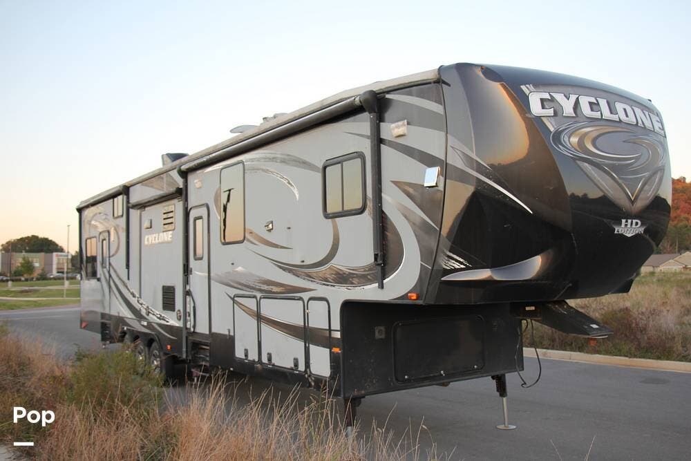2014 Heartland Cyclone 3950 - Used Toy Hauler For Sale by Pop RVs in Ringgold, Georgia features Leveling Jacks, Generator, Slideout, Awning, Air Conditioning