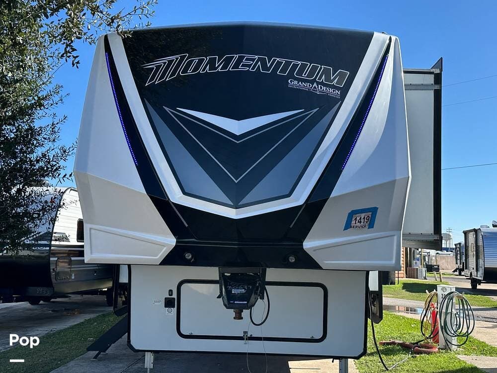 2024 Grand Design Momentum 395MS - Used Toy Hauler For Sale by Pop RVs in Weatherford, Texas features Awning, Slideout, Leveling Jacks, Generator, Air Conditioning