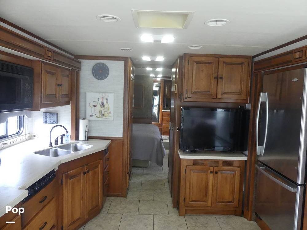 2012 Tiffin Allegro Red 38QRA - Used Diesel Pusher For Sale by Pop RVs in Melbourne, Florida features Awning, Air Conditioning, Generator, Leveling Jacks, Slideout