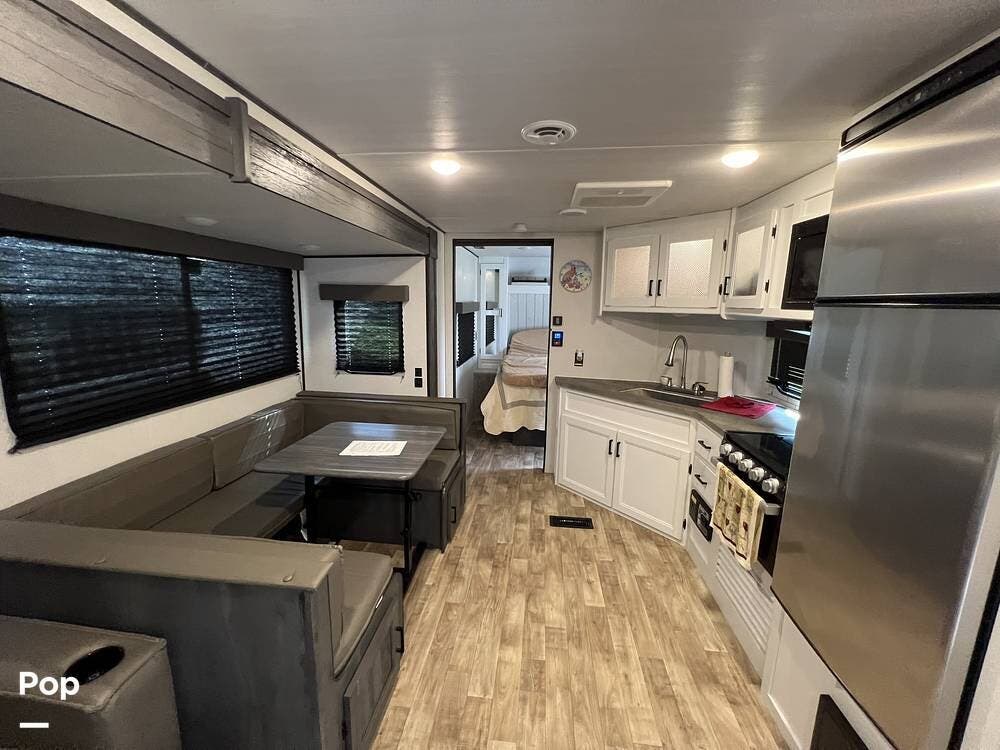 2023 Keystone Hideout 29DFS - Used Travel Trailer For Sale by Pop RVs in Naples, Florida features Awning, Leveling Jacks, Air Conditioning, Slideout