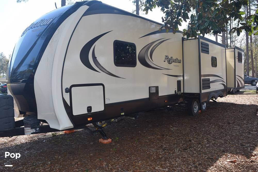 2019 Forest River Reflection 312BHTS - Used Travel Trailer For Sale by Pop RVs in Navarre, Florida features Leveling Jacks, Air Conditioning, Slideout, Awning