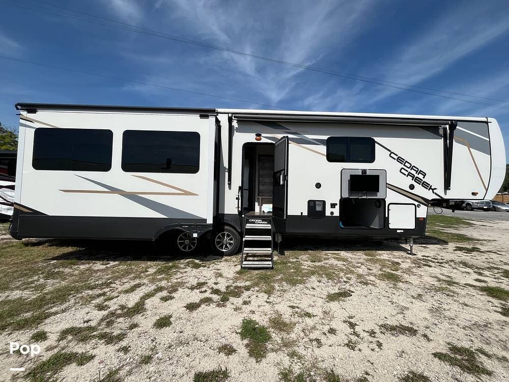 2021 Forest River Cedar Creek 388DB - Used Fifth Wheel For Sale by Pop RVs in St Augustine Beach, Florida features Leveling Jacks, Slideout, Awning, Air Conditioning