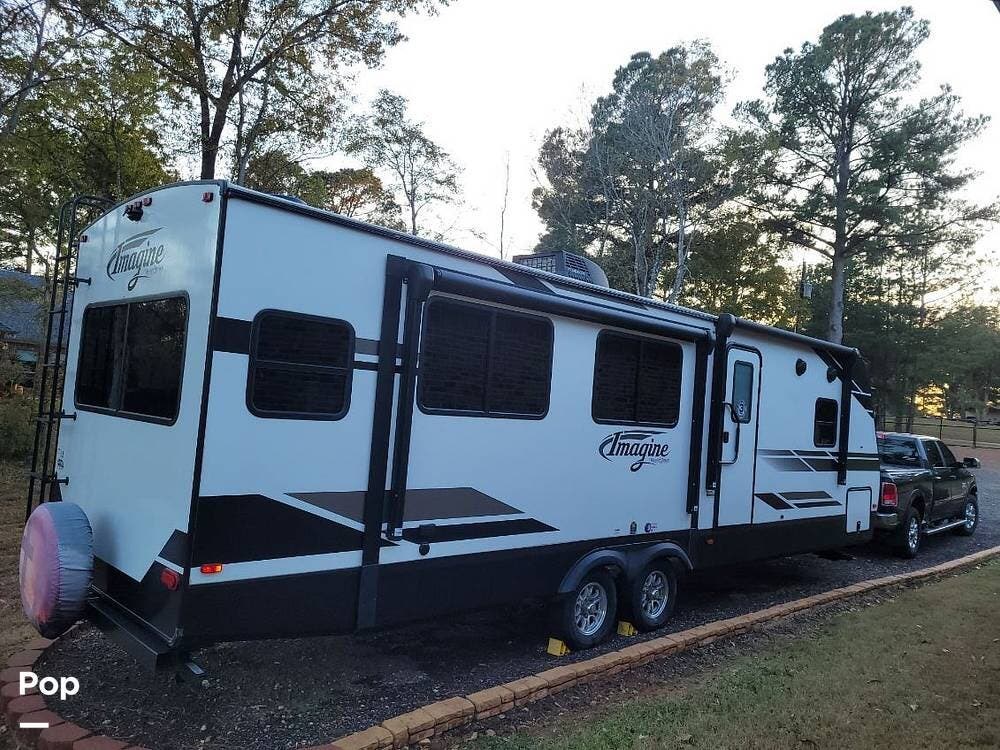 2022 Grand Design Imagine 2970RL - Used Travel Trailer For Sale by Pop RVs in Jacksonville, Texas features Leveling Jacks, Slideout, Air Conditioning, Awning