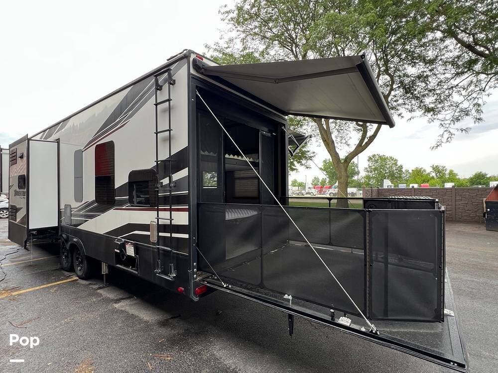 2020 Grand Design Momentum 349M - Used Toy Hauler For Sale by Pop RVs in Bartlett, Illinois features Awning, Air Conditioning, Generator, Slideout