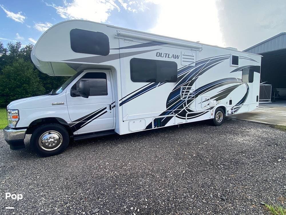 2022 Thor Motor Coach Outlaw 29J - Used Toy Hauler For Sale by Pop RVs in Okeechobee, Florida features Generator, Leveling Jacks, Awning, Air Conditioning, Slideout