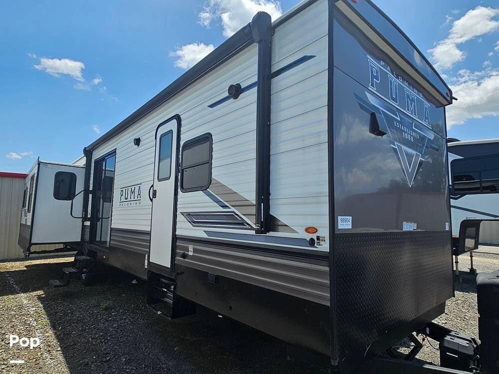 2023 Palomino Puma 38RLB - Used Travel Trailer For Sale by Pop RVs in Sherwood, Arkansas features Air Conditioning, Leveling Jacks, Slideout, Awning