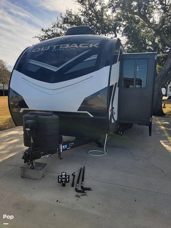 2024 Keystone Outback 271UFK - Used Travel Trailer For Sale by Pop RVs in Nekoosa, Wisconsin features Slideout, Awning, Air Conditioning, Leveling Jacks