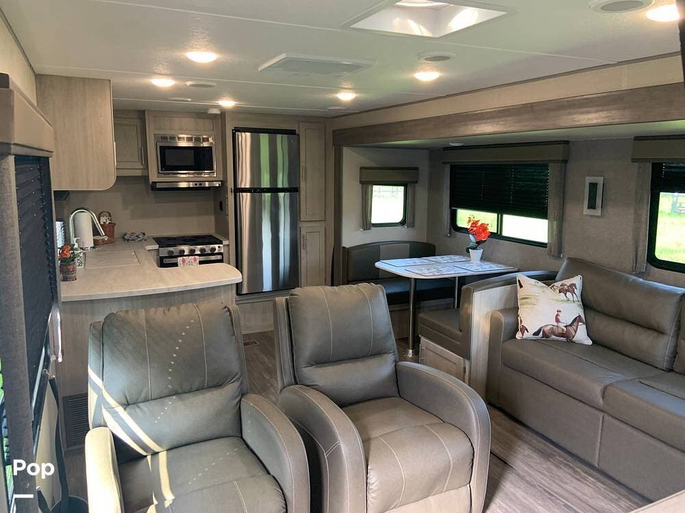 2023 Forest River Aurora Sky Series 310KDS - Used Travel Trailer For Sale by Pop RVs in Lexington, Kentucky features Slideout, Leveling Jacks, Air Conditioning