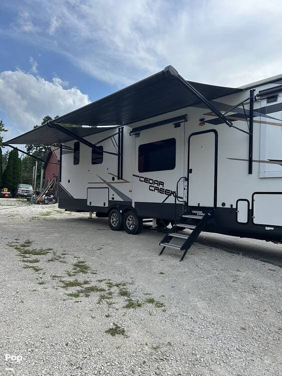 2021 Forest River Cedar Creek 371FL - Used Fifth Wheel For Sale by Pop RVs in Sheridan, Illinois features Slideout, Leveling Jacks, Awning, Air Conditioning