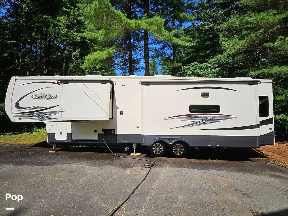 2020 Forest River Cedar Creek 38FBD - Used Fifth Wheel For Sale by Pop RVs in Granby, Connecticut features Air Conditioning, Slideout, Awning, Leveling Jacks