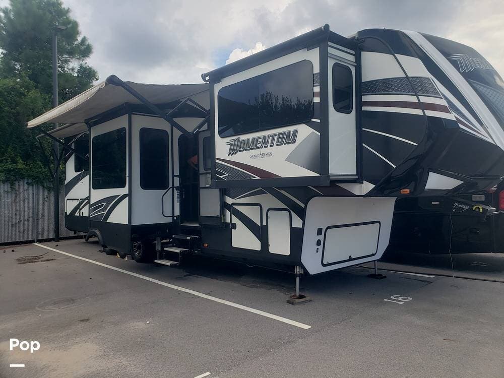 2017 Grand Design Momentum 376TH - Used Toy Hauler For Sale by Pop RVs in Gulf Breeze, Florida features Air Conditioning, Slideout, Awning, Generator, Leveling Jacks