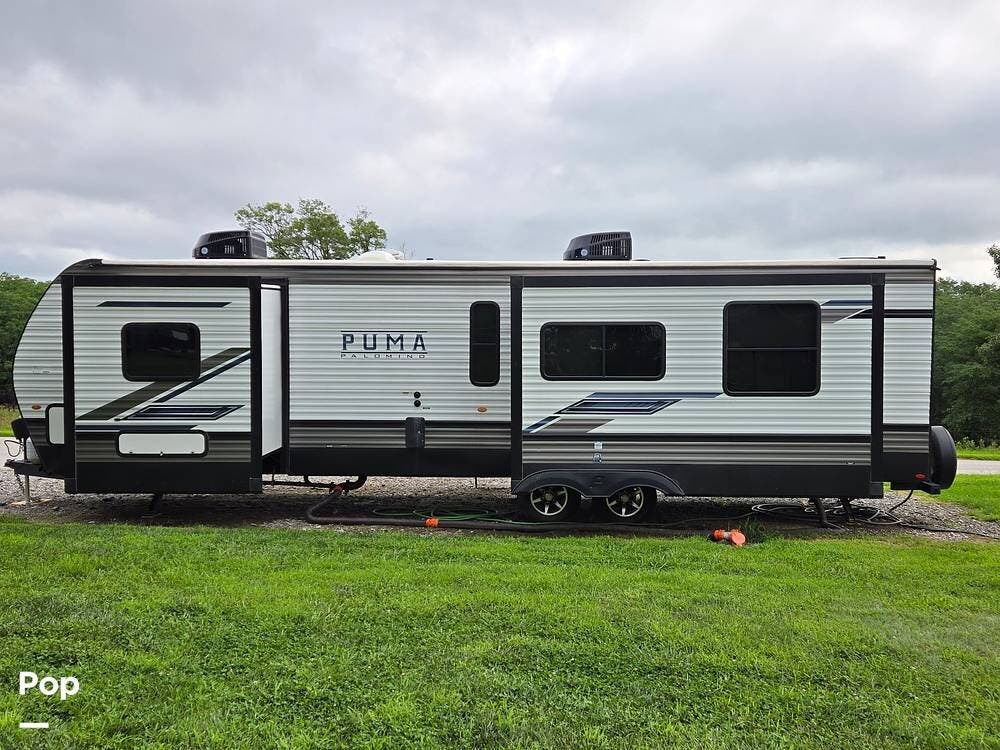 2023 Palomino Puma 30RKQS - Used Travel Trailer For Sale by Pop RVs in Honey Creek, Iowa features Awning, Air Conditioning, Slideout, Leveling Jacks