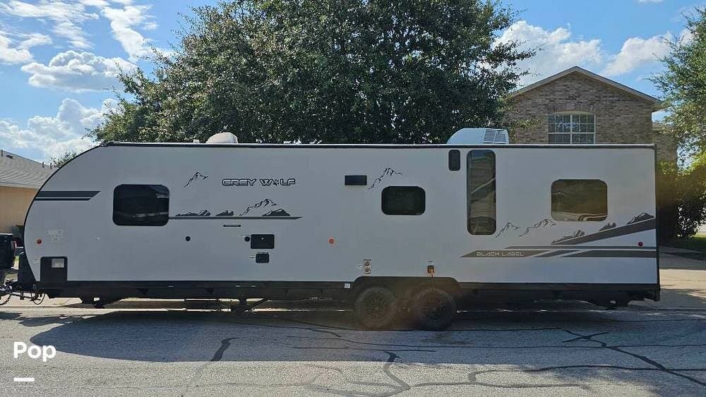 2021 Forest River Grey Wolf 26MBRRBL - Used Toy Hauler For Sale by Pop RVs in Manor, Texas features Leveling Jacks, Awning, Air Conditioning