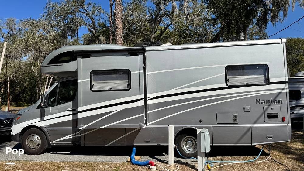 2023 Winnebago Navion 24V - Used Class C For Sale by Pop RVs in Summerfield, Florida features Generator, Air Conditioning, Slideout, Leveling Jacks, Awning