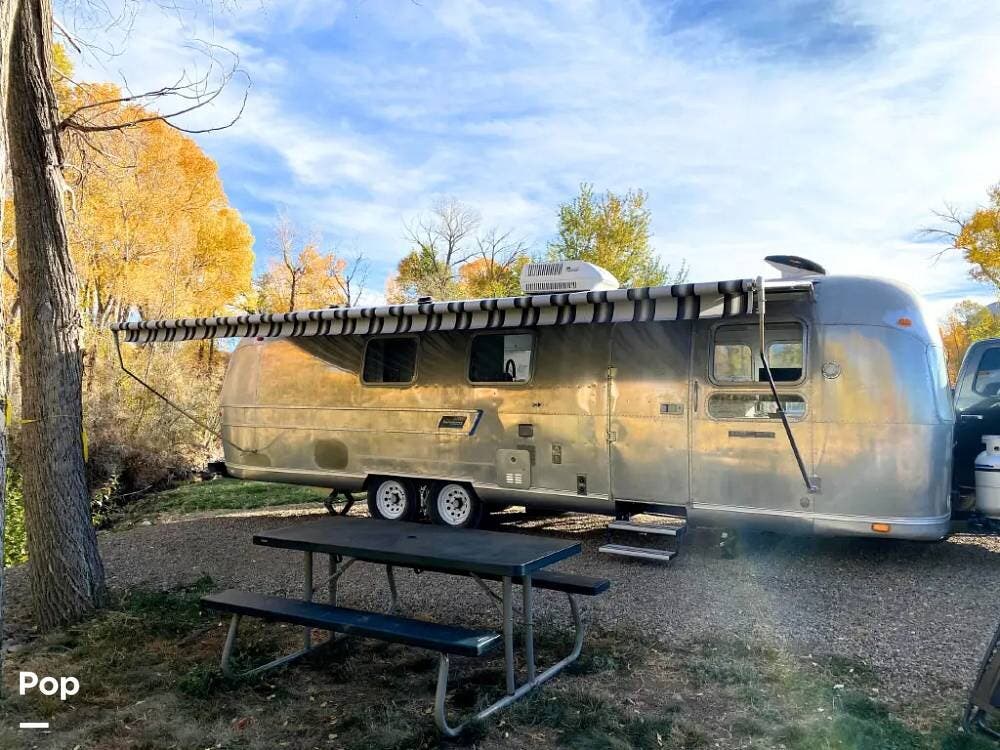 1973 Airstream Sovereign 31 - Used Travel Trailer For Sale by Pop RVs in Brookshire, Texas features Awning, Air Conditioning, Leveling Jacks