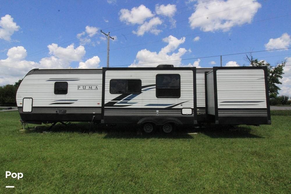 2022 Forest River Puma 32BHQS - Used Travel Trailer For Sale by Pop RVs in Washington Court House, Ohio features Slideout, Awning, Leveling Jacks, Air Conditioning