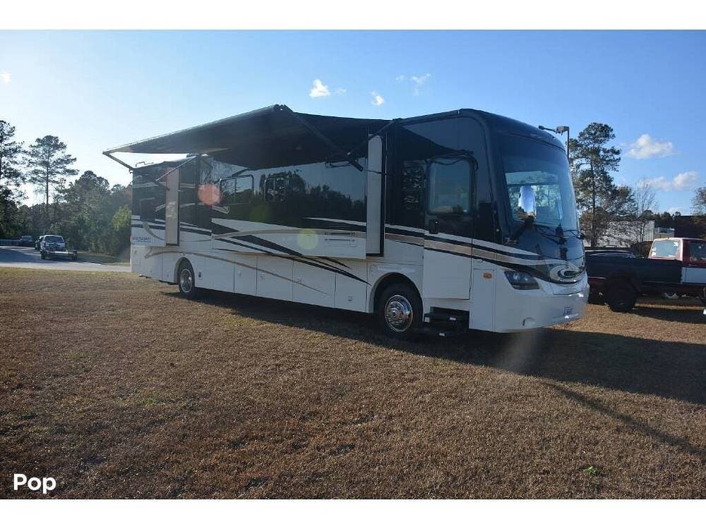 2013 Coachmen Sportscoach 405FK - Used Diesel Pusher For Sale by Pop RVs in Rincon, Georgia features Slideout, Generator, Air Conditioning, Leveling Jacks, Awning