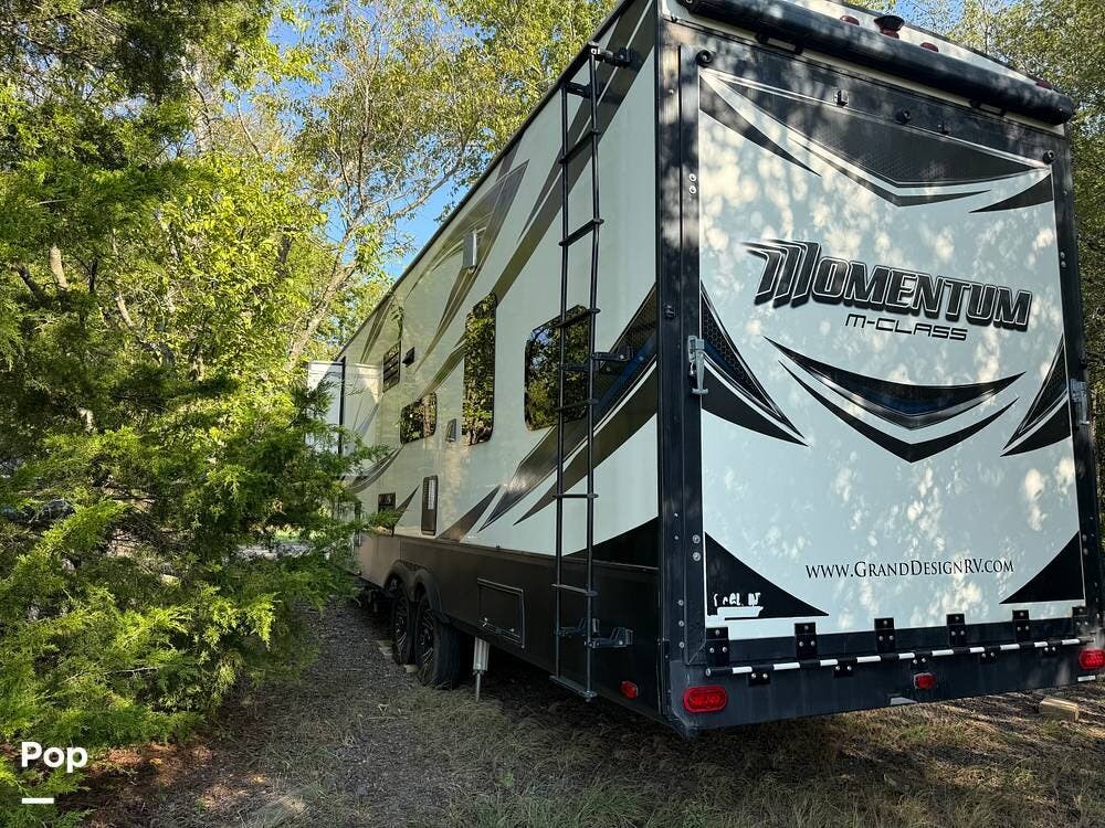 2017 Grand Design Momentum 328M - Used Toy Hauler For Sale by Pop RVs in Royse City, Texas features Slideout, Air Conditioning, Awning, Leveling Jacks, Generator