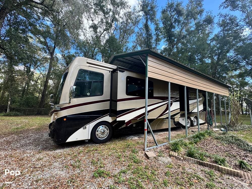 2018 Fleetwood Discovery LXE 44H - Used Diesel Pusher For Sale by Pop RVs in Brooksville, Florida features Leveling Jacks, Generator, Air Conditioning, Slideout, Awning