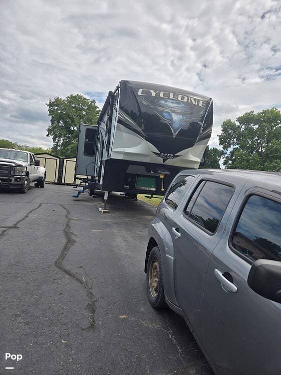 2018 Heartland Cyclone 4005 - Used Toy Hauler For Sale by Pop RVs in Plattsburg, Missouri features Leveling Jacks, Air Conditioning, Slideout, Awning, Generator