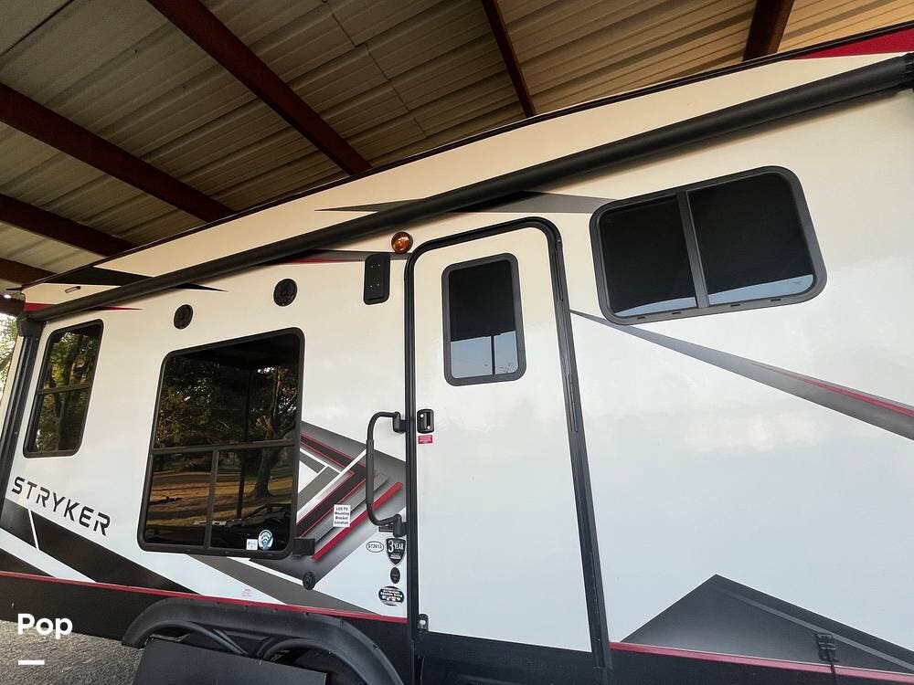 2023 Cruiser RV Stryker ST2613 - Used Toy Hauler For Sale by Pop RVs in Teague, Texas features Awning, Slideout, Air Conditioning, Leveling Jacks