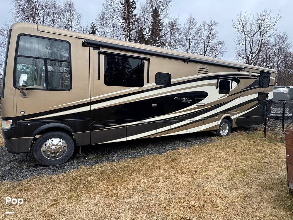 2015 Newmar Canyon Star 3921 - Used Toy Hauler For Sale by Pop RVs in Anchorage, Alaska features Air Conditioning, Slideout, Generator, Leveling Jacks, Awning