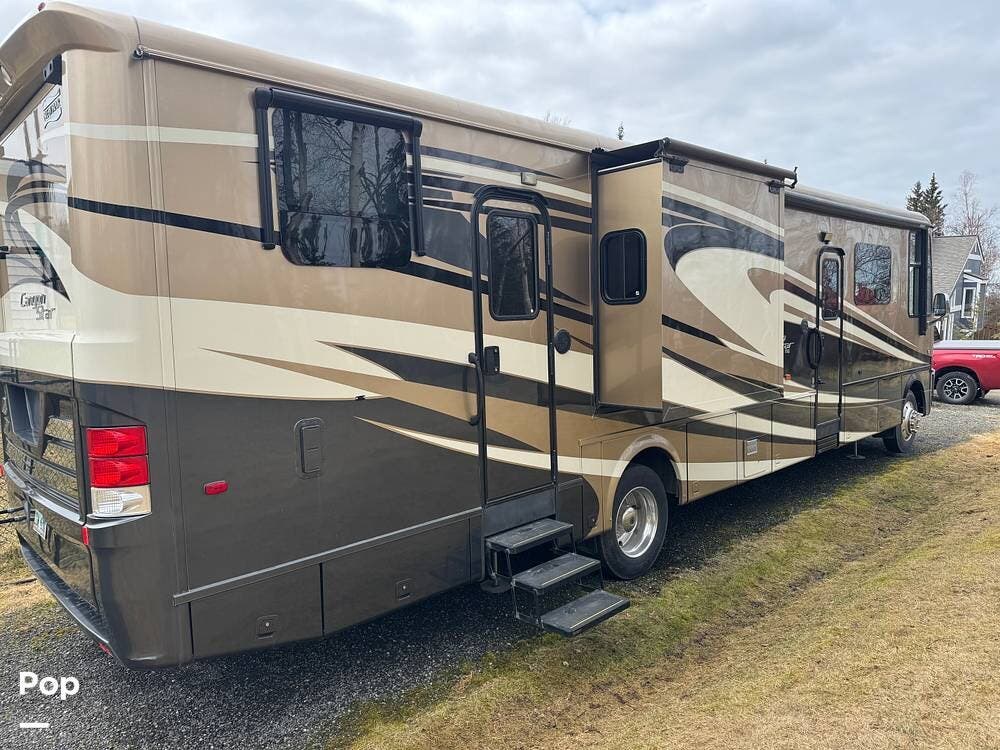 2015 Newmar Canyon Star 3921 - Used Toy Hauler For Sale by Pop RVs in Anchorage, Alaska features Awning, Leveling Jacks, Slideout, Generator, Air Conditioning
