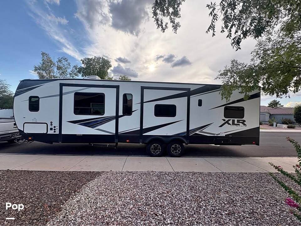 2021 Forest River XLR Hyperlite 3310 - Used Toy Hauler For Sale by Pop RVs in Surprise, Arizona features Slideout, Awning, Air Conditioning, Generator