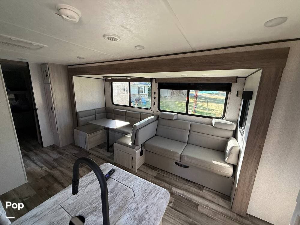 2026 CrossRoads Zinger 328SB - Used Travel Trailer For Sale by Pop RVs in Rockton, Illinois features Slideout, Awning, Leveling Jacks, Air Conditioning