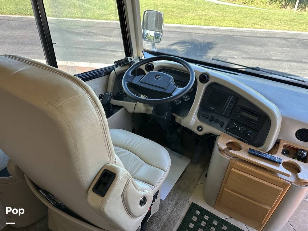 2006 Tiffin Phaeton 40QDH - Used Diesel Pusher For Sale by Pop RVs in Palmetto, Florida features Leveling Jacks, Air Conditioning, Slideout, Awning, Generator