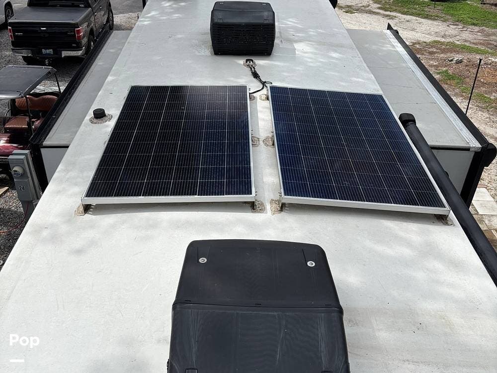 2023 Grand Design Momentum 395MS-R - Used Toy Hauler For Sale by Pop RVs in Palmetto, Florida features Air Conditioning, Slideout, Generator, Awning