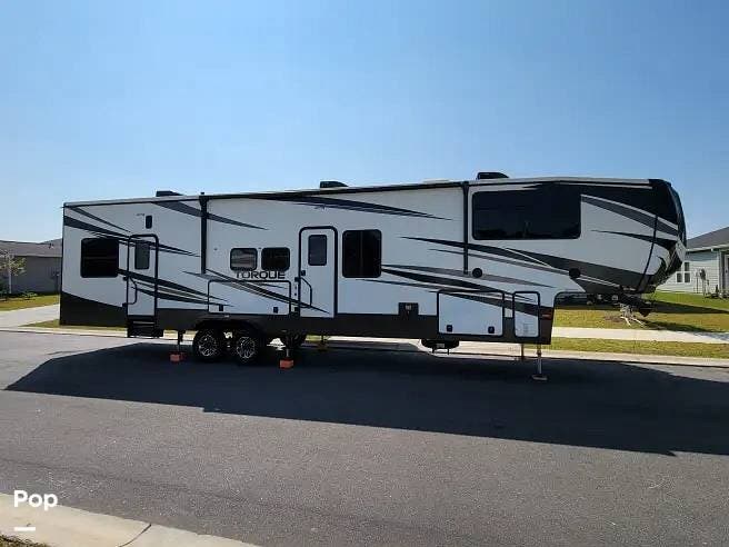 2021 Heartland Torque 373 - Used Toy Hauler For Sale by Pop RVs in Loris, South Carolina features Air Conditioning, Awning, Generator, Leveling Jacks, Slideout