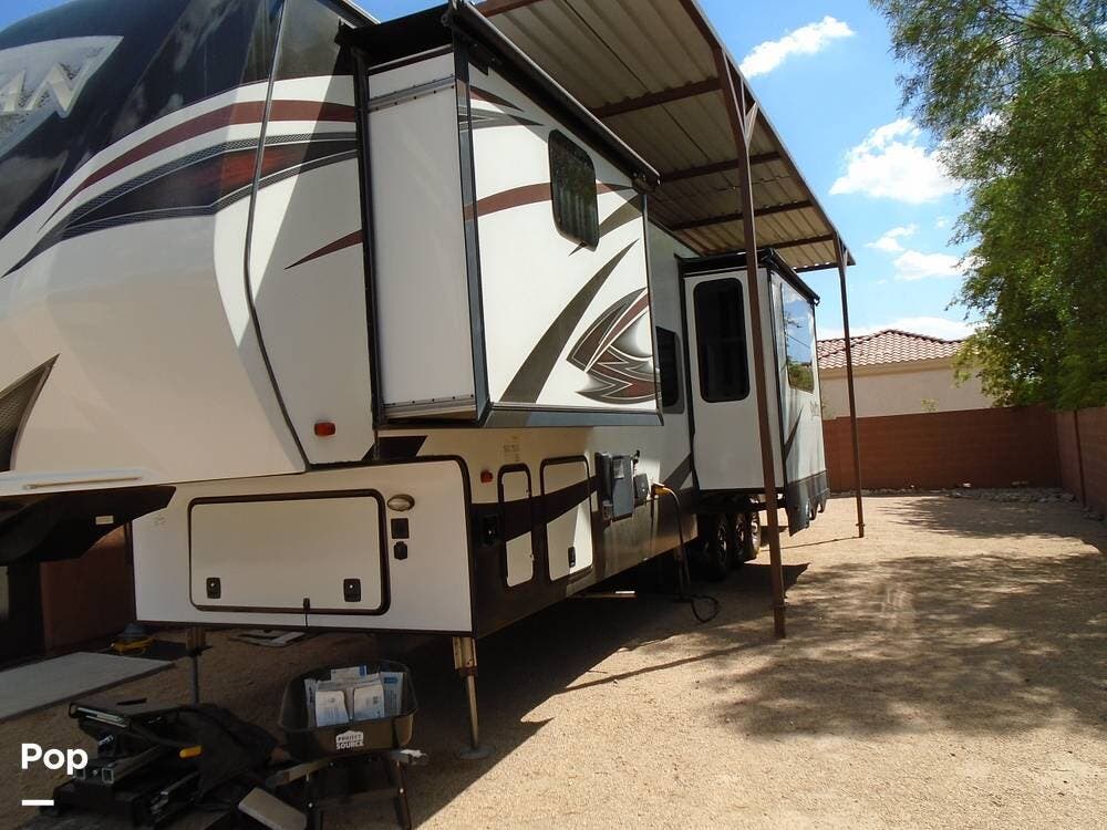 2017 Prime Time Spartan 1245 - Used Toy Hauler For Sale by Pop RVs in Peoria, Arizona features Awning, Leveling Jacks, Generator, Air Conditioning, Slideout