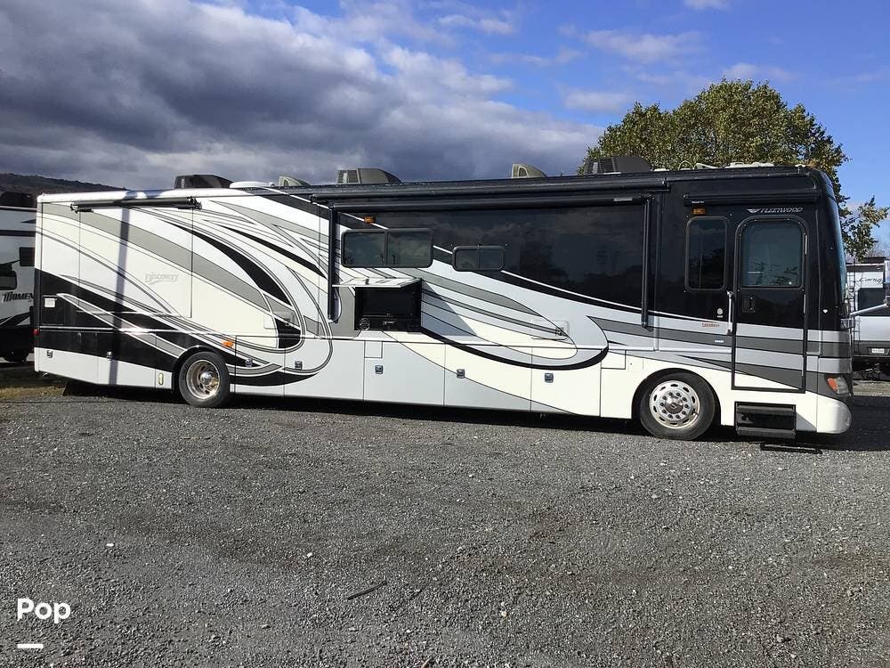 2012 Fleetwood Discovery 40X - Used Diesel Pusher For Sale by Pop RVs in Thurmont, Maryland features Awning, Slideout, Leveling Jacks, Generator, Air Conditioning
