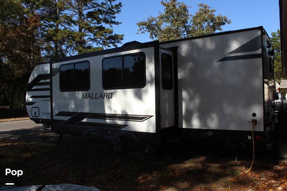 2023 Heartland Mallard M260 - Used Travel Trailer For Sale by Pop RVs in Hot Springs National Park, Arkansas features Awning, Leveling Jacks, Slideout, Air Conditioning