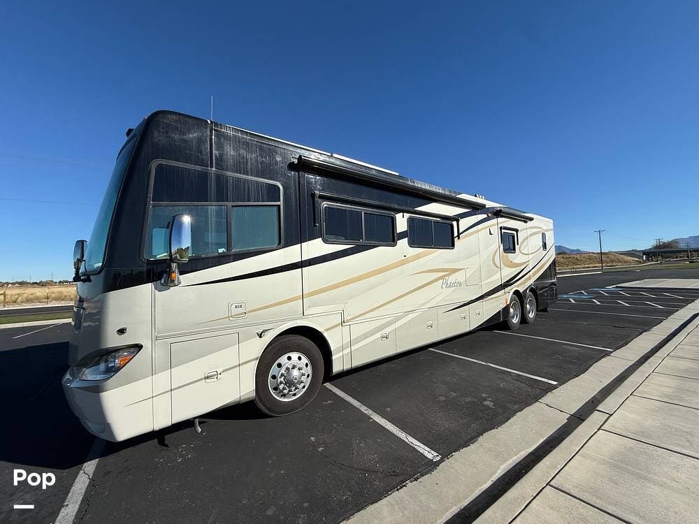 2011 Tiffin Phaeton 42QBH - Used Diesel Pusher For Sale by Pop RVs in Syracuse, Utah features Leveling Jacks, Slideout, Generator, Air Conditioning, Awning