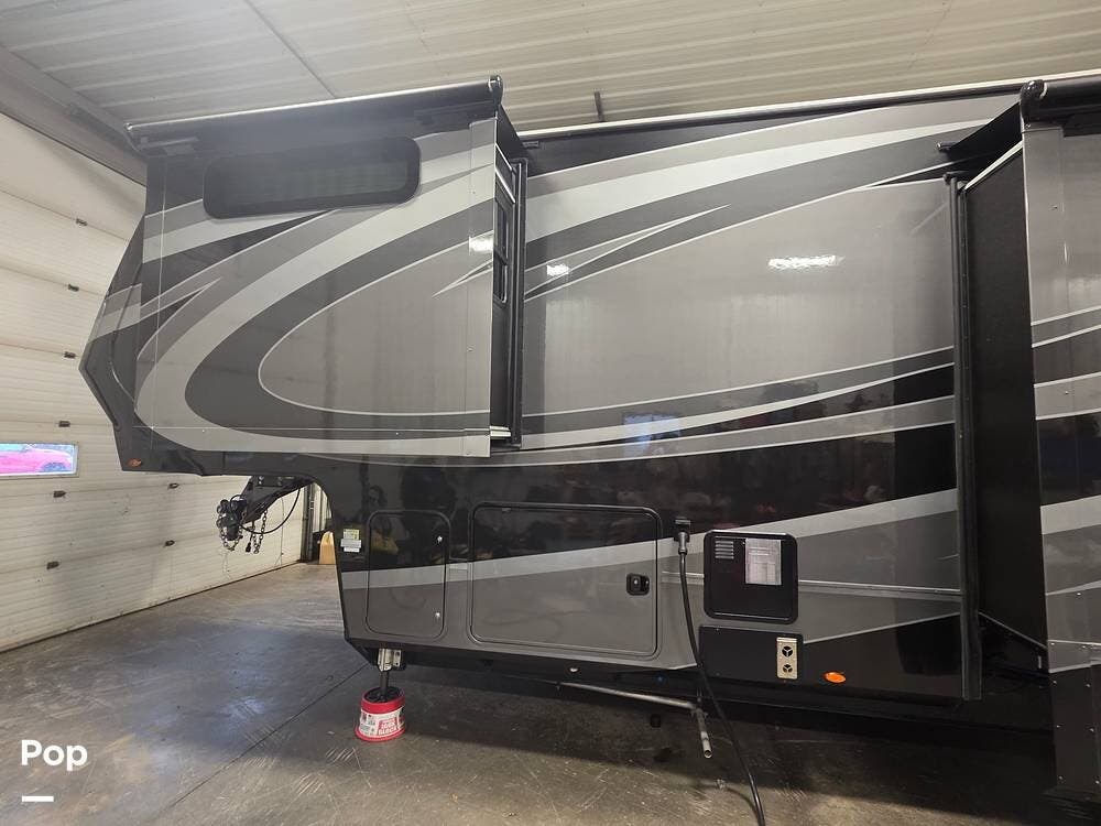 2022 Grand Design Momentum 397TH-R - Used Toy Hauler For Sale by Pop RVs in South Wales, New York features Slideout, Air Conditioning, Leveling Jacks, Generator, Awning