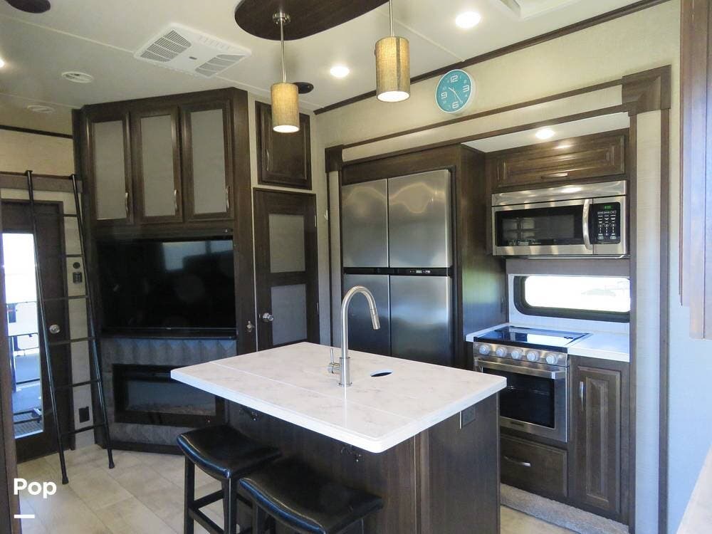 2019 Grand Design Momentum 351M - Used Toy Hauler For Sale by Pop RVs in Ocala, Florida features Leveling Jacks, Awning, Slideout, Generator, Air Conditioning