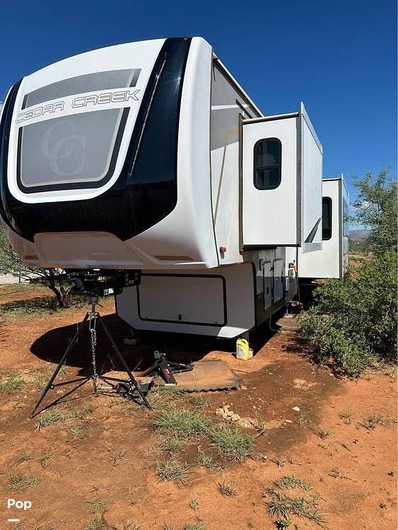 2021 Forest River Cedar Creek 355LF - Used Fifth Wheel For Sale by Pop RVs in Huachuca City, Arizona features Slideout, Leveling Jacks, Awning, Air Conditioning
