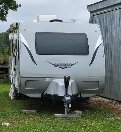 2020 Lance Lance 2465 - Used Travel Trailer For Sale by Pop RVs in Algoma, Wisconsin features Awning, Leveling Jacks, Slideout, Air Conditioning