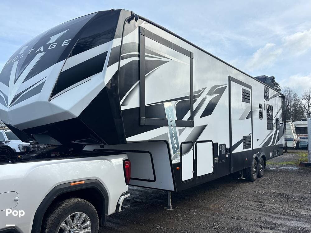 2022 Dutchmen Voltage 3551 - Used Toy Hauler For Sale by Pop RVs in Battle Ground, Washington features Air Conditioning, Awning, Leveling Jacks, Slideout