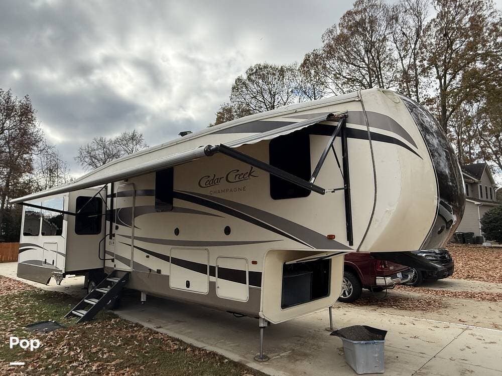 2017 Forest River Cedar Creek Champagne 38EL - Used Fifth Wheel For Sale by Pop RVs in Moyock, North Carolina features Awning, Slideout, Leveling Jacks, Air Conditioning