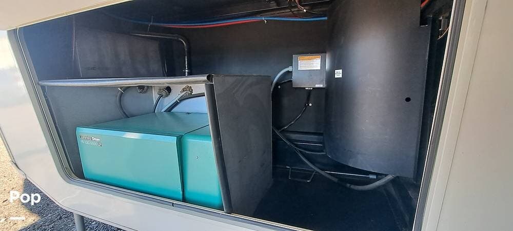 2015 Forest River Cedar Creek 36CKTS - Used Fifth Wheel For Sale by Pop RVs in Brighton, Colorado features Leveling Jacks, Air Conditioning, Generator, Awning, Slideout